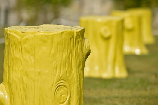 3) The twin rows of five ceramic tree stumpsare finished in a bright yellow glaze